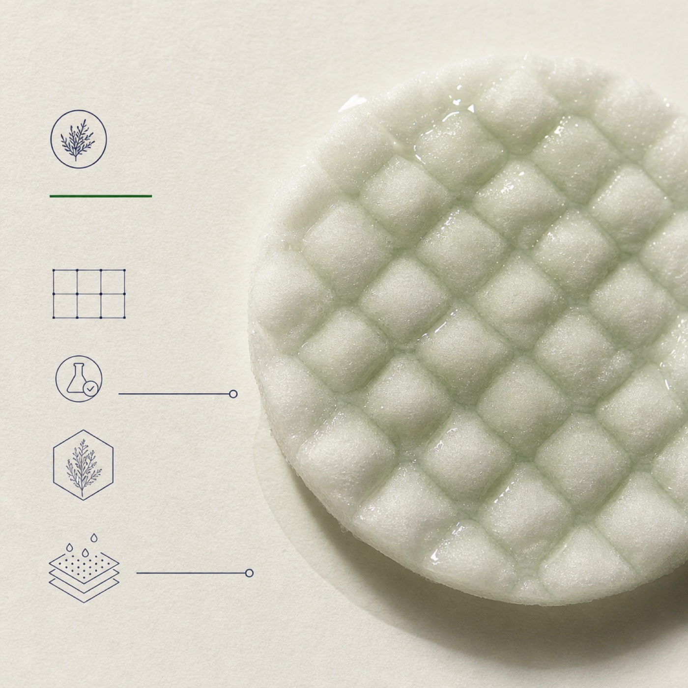 a quilted cotton chitosan soothing pad soaked in clear sage-tinted essence